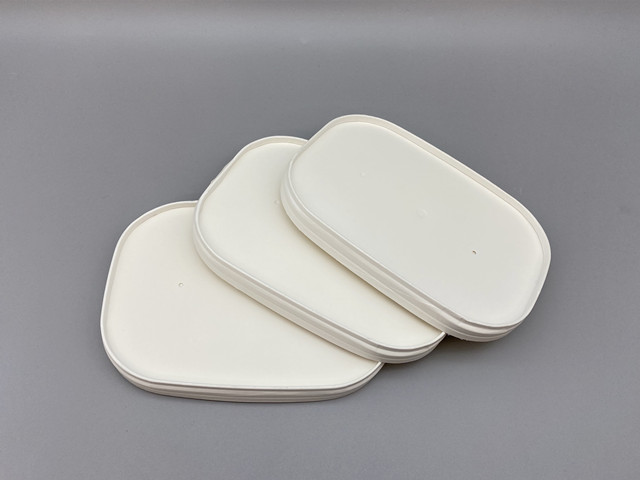 White cardboard container lid